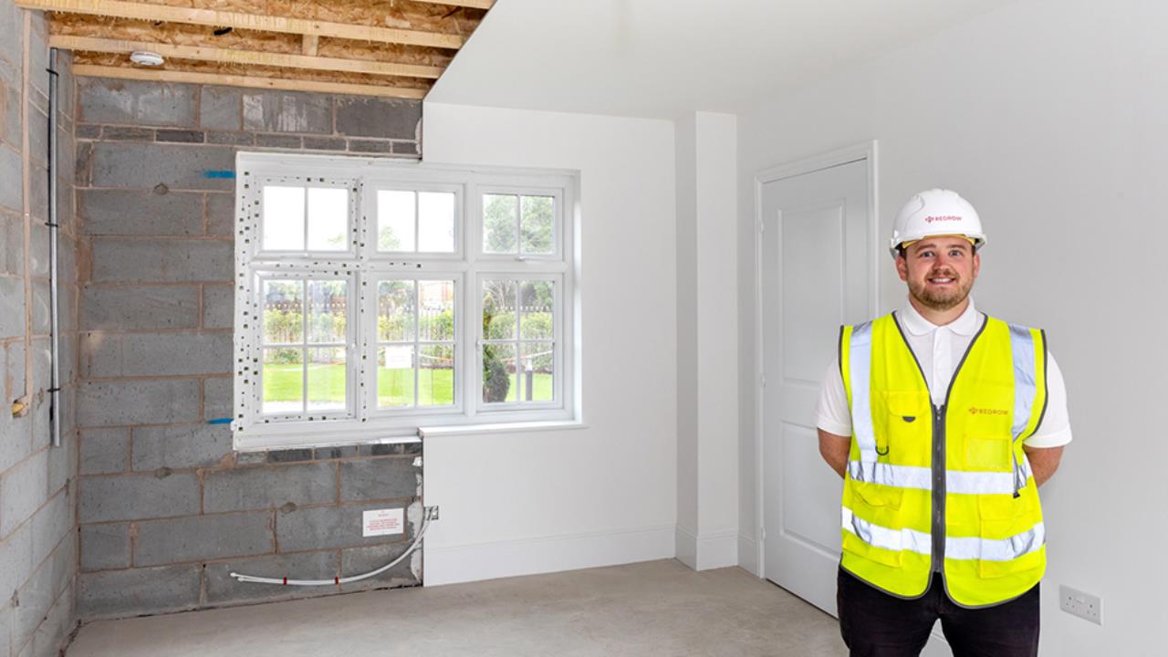 Header - Redrow site manager Louis Caplin in the half-and- half lounge
