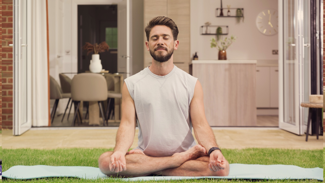 Redrow | Inspiration | Man Doing Yoga in Garden