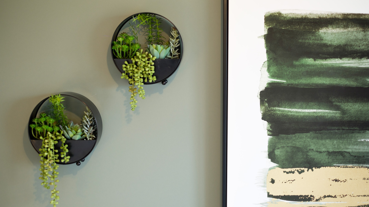 Redrow - Inspiration - 2 circular wall planters next to painting