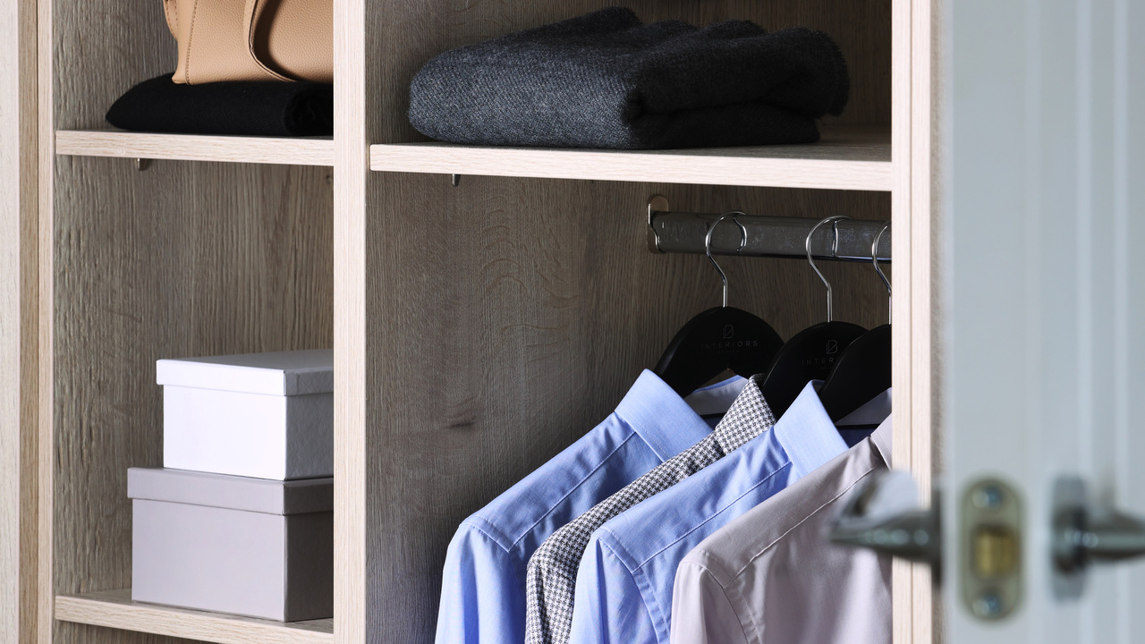 Redrow - Inspiration - Top tips for cleaning a cluttered house - Wardobe with clothes