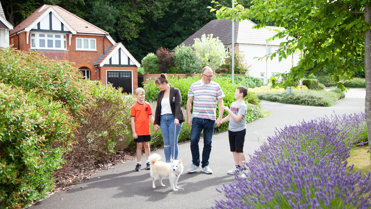 Redrow - Inspiration - Family take dog for a walk ar Redrow Development