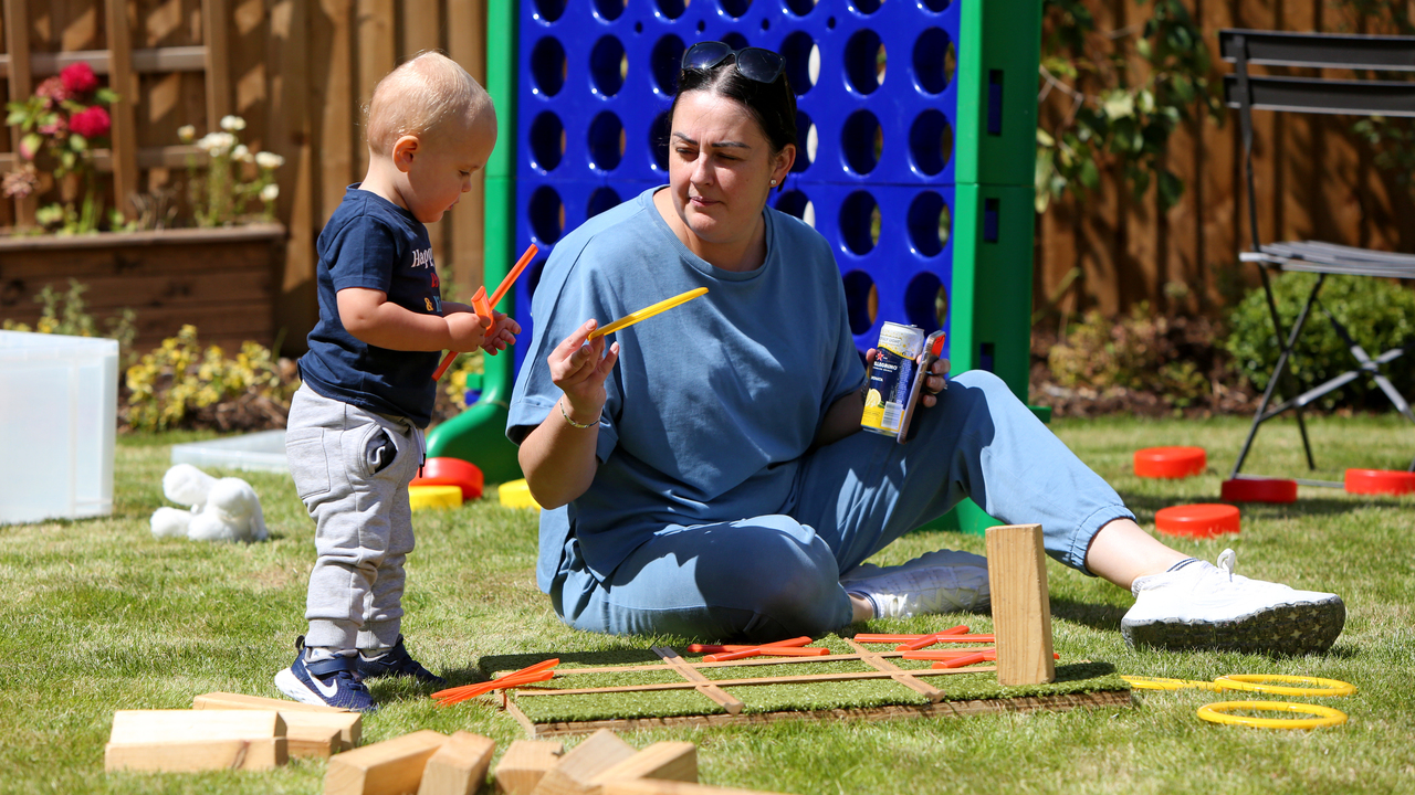 Redrow - Inspiration - Mother and son plays games in the garden