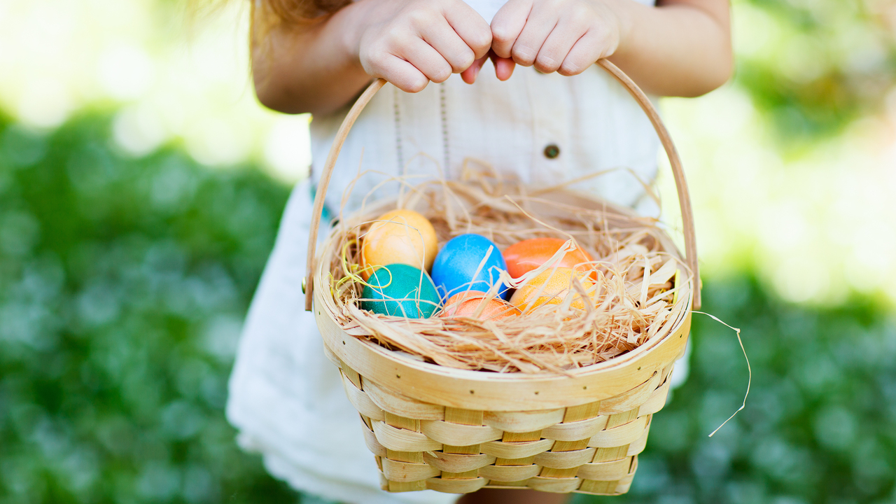 Redrow - Inspiration - Girl holding basket full of Easter eggs
