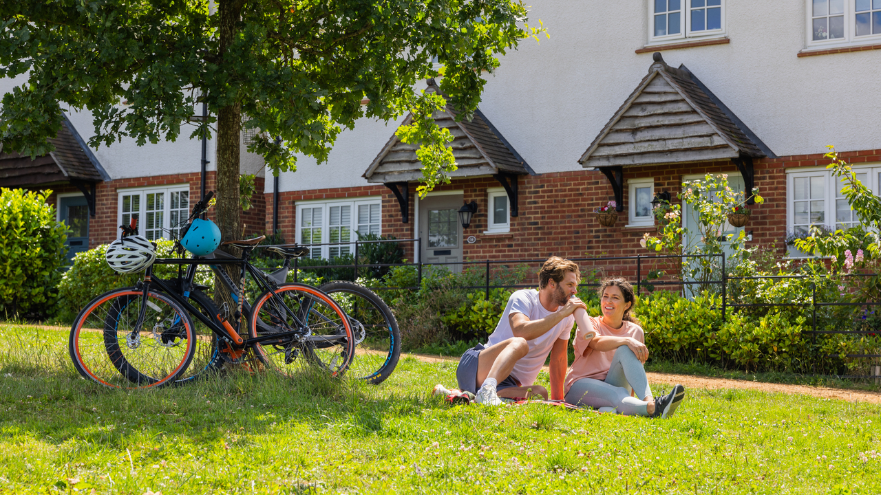 Redrow - Inspiration - Couple resting with bikes