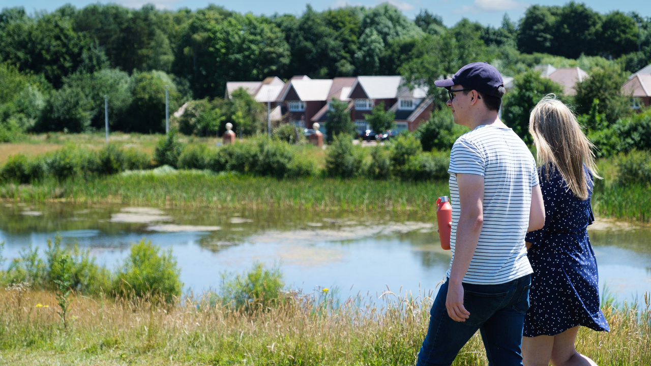 Redrow - Inspiration - Couple walking by pond