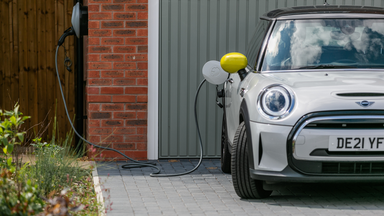 Redrow - Inspiration  - Car plugged into an electric car charger at a redrow home