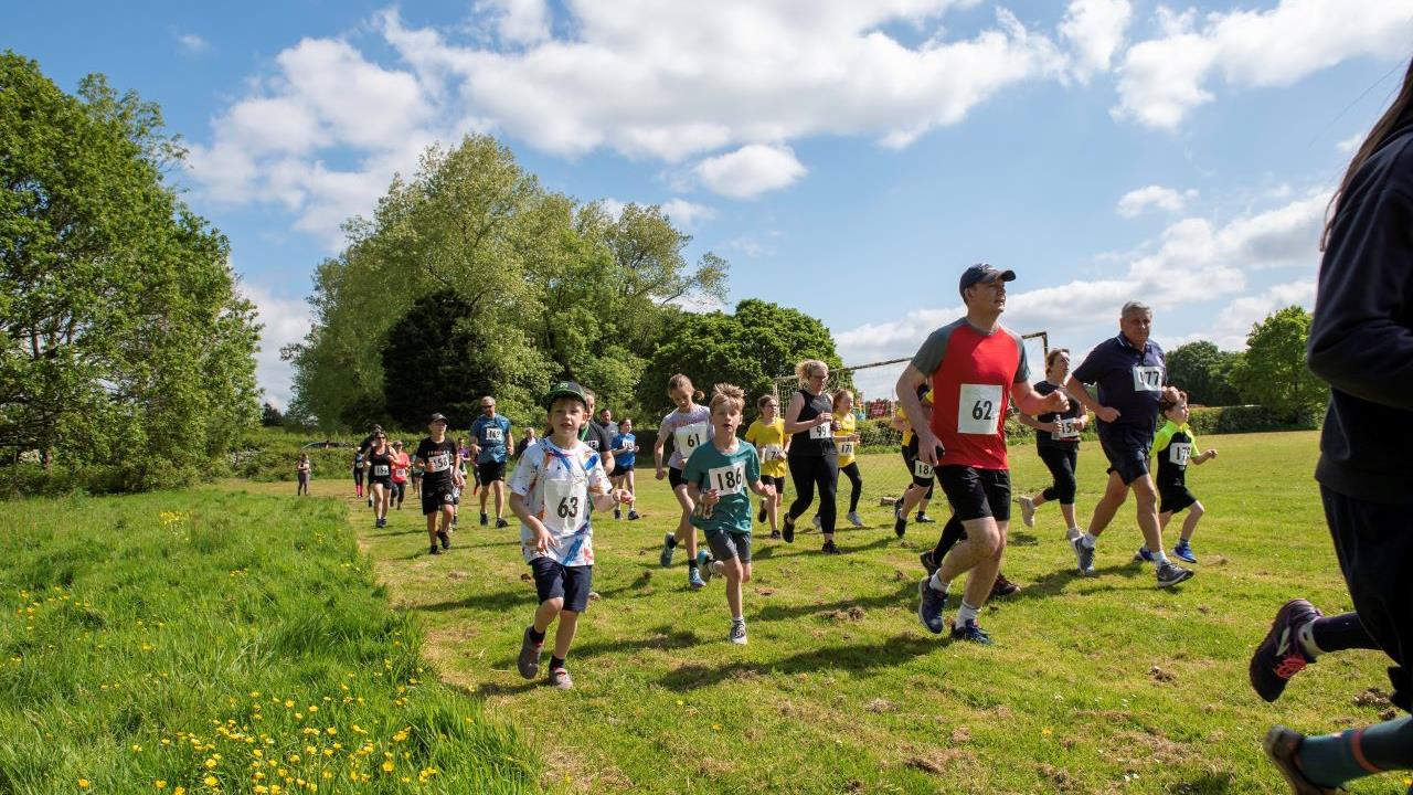 Redrow - News - Going for gold donation made towards local school Fun Run