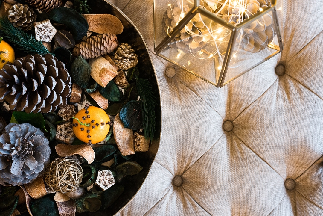 Redrow | Inspiration | A rustic metal bowl filled with scented pine cones and homemade festive potpourri